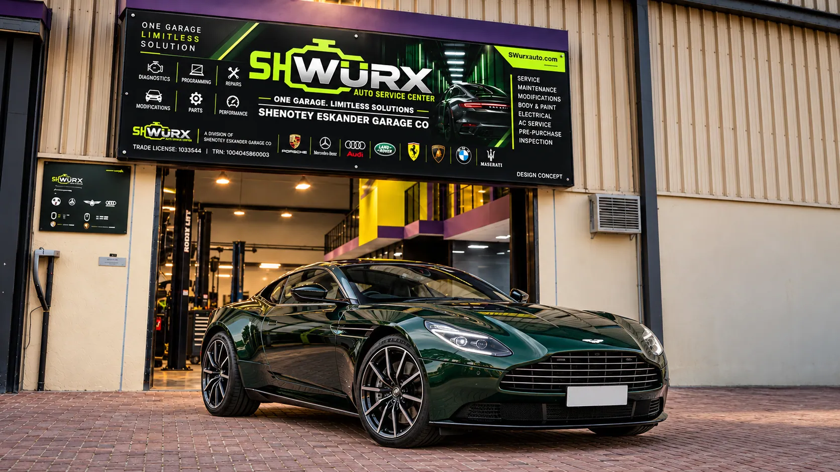 Aston Martin outside the SHWURX-branded workshop facade