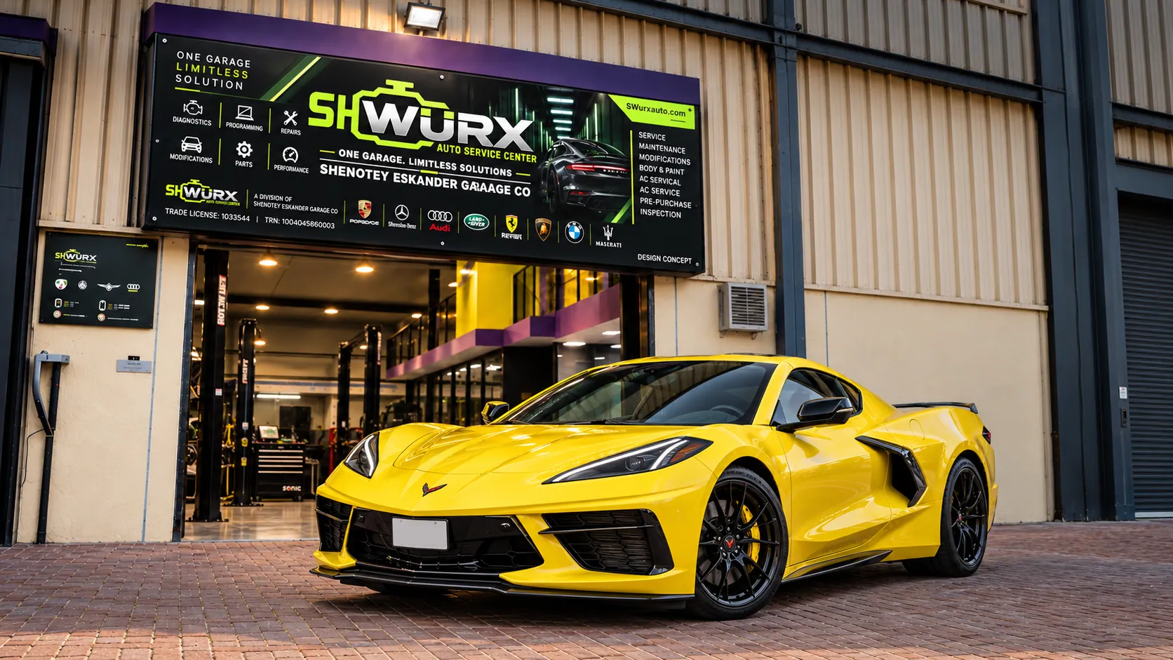 Chevrolet Corvette outside the SHWURX-branded workshop facade