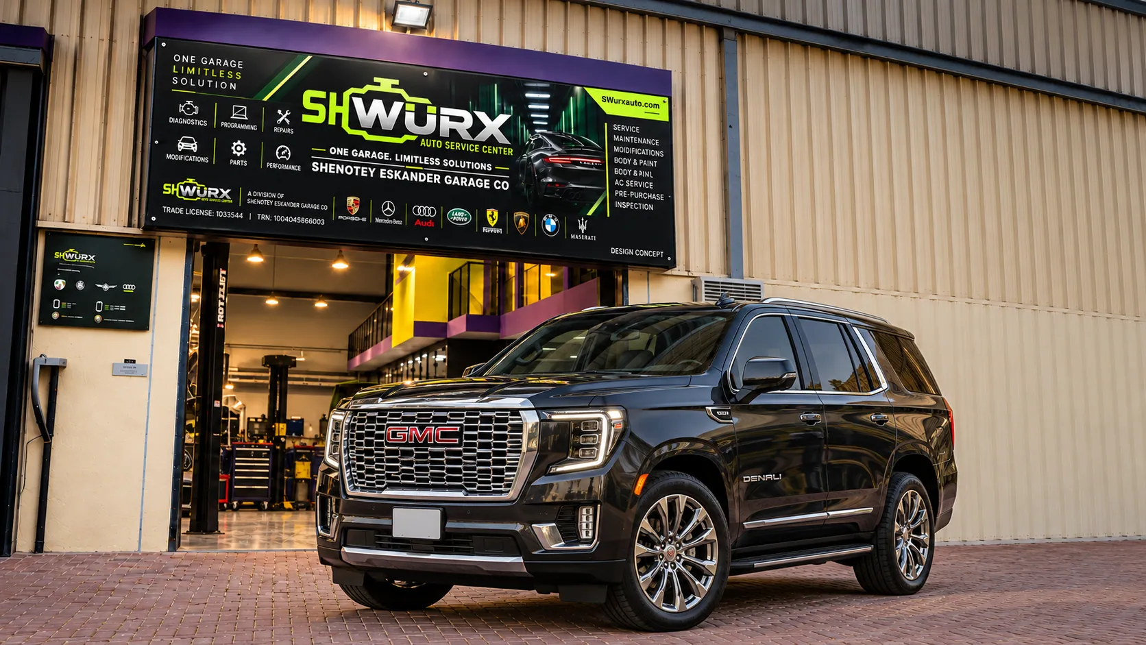 Gmc outside the SHWURX-branded workshop facade