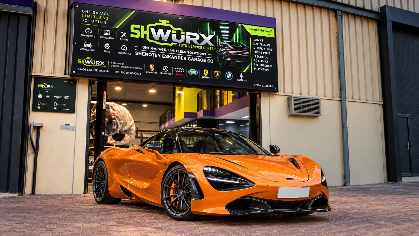 Mclaren outside the SHWURX-branded workshop facade