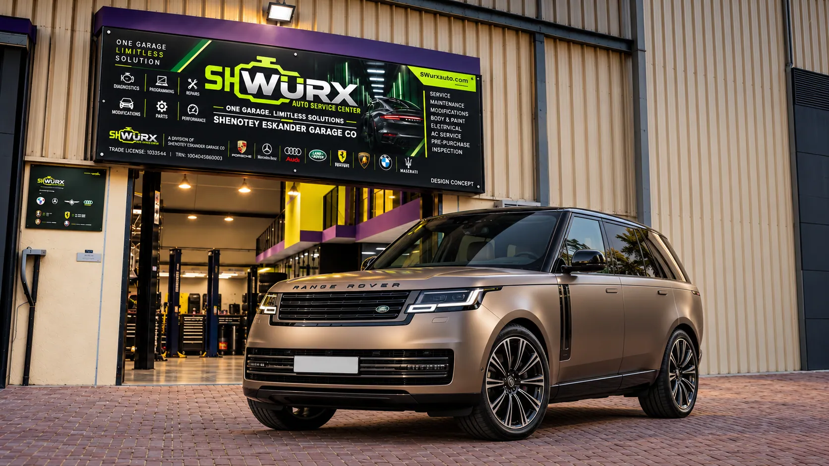 Range Rover outside the SHWURX-branded workshop facade